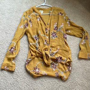 Long sleeve button down V-neck mustard colored shirt with floral embroidered